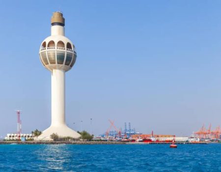 White lighthouse and traffic control tower as a symbol of the port of Jeddah, Saudi Arabia