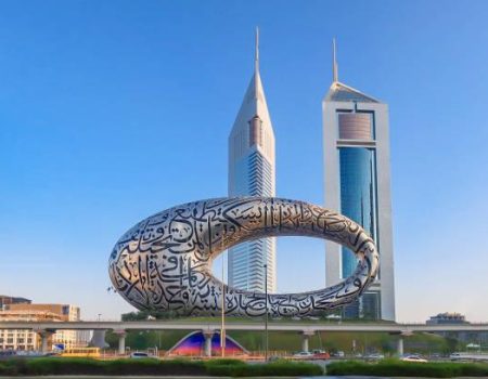 Dubai, UAE - November 27, 2021: Panoramic view of Museum of Future and Emirates towers buildings. Modern futuristic Museum built according designed by architect Shaun Killa.